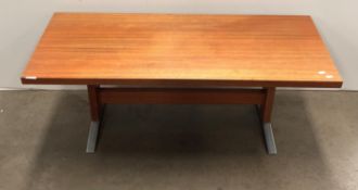A mid century Danish teak coffee table with chrome feet,