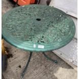 A green painted aluminium patio table,