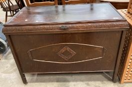 The Hold-All oak lift-top blanket box on castors,