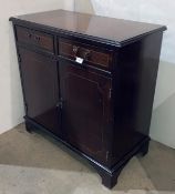 A reproduction mahogany two-drawer two-door unit, 76cm x 39cm x 77cm.