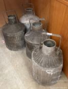 Four vintage ribbed galvanised motor oil cans with handles but no caps,