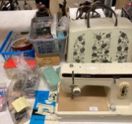 Jones 691 electric sewing machine (as new), together with a large quantity of buttons, threads,