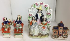 Four antique Staffordshire flatback pieces - a man and two women with playing cards in their hands