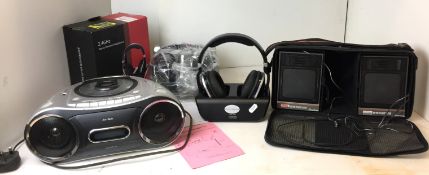 Four pieces of audio equipment - two pairs of stereo wireless head phones - one in original
