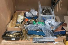 Contents to end of rack - brass/chrome door handles, brass/chrome two gang sockets,