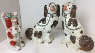 Three pieces of antique Staffordshire Pottery - pair of Spaniels 32cm high,