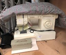 Singer sewing machine 'Melodie 50' complete with manual attachments,