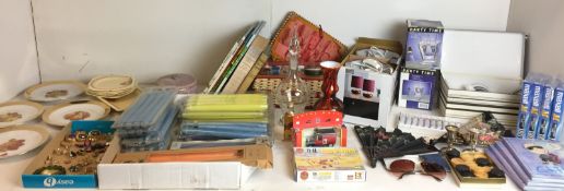 Sixty plus items - ten packs of candles, boxed Café Vogue two cups and two saucers,