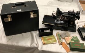 Vintage Singer 222k feather weight sewing machine known as 'the free arm model' with case and