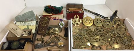 Fifty plus items including thirty four-horse brasses, volt meter,