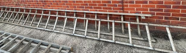 An aluminium thirty-six rung double extension ladder (CWH Ref: Yard)