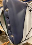 A blue folding massage table in grey canvas bag (CWH Ref: J07)