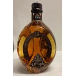A 70cl bottle of The Original Dimple 15 Year Old Fine Old Original De Luxe Scotch Whisky 40% volume