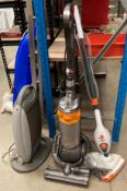 A Dyson upright vacuum cleaner,