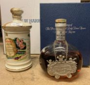 A part bottle of Whyte and Mackay Deluxe 12 Years Old Blended Scotch Whisky in a presentation box