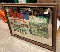 A framed reproduction Tetley Bitter pub mirror,