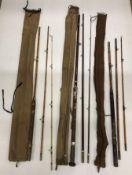 A vintage three piece Holecane rod with fibre glass end 10' 7" and two other vintage three piece