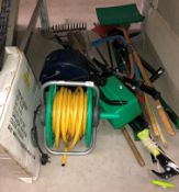 Contents to part under rack, a quantity of garden tools to include snow shovels, spades, forks,