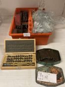 Contents to orange storage tray, small tin and wood box and a quantity of number & letter punches,