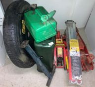 2 x red trolley jacks, green metal jerry can, space saver wheel,