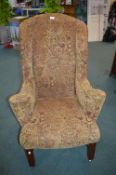 Large Mahogany Framed Wingback Armchair with Paisley Style Upholstery