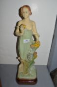 1920’s Plaster Figure of a Girl with Flowers