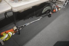 Eckman Extendable Garden Multitool and a a Garden Fork