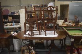 Extending Dining Table on Tripod with Brass Castors, and Four Chairs