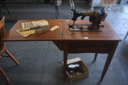 Vintage Jones manual Sewing Machine on Cabinet