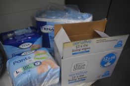 Quantity of Tena Incontinence Pants, Pads, and Box of Baby Wipes (expired)