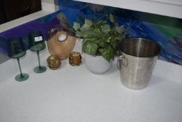 *Assorted Display Items Including Glassware, Artificial Plant, and a Stainless Steel Ice Bucket