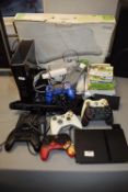 Assorted Gaming Devices Including Xbox 360, PlayStation 2, Wii Fit, etc.