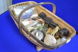 Trunk Containing Decorative Items Including a Tribal Carving