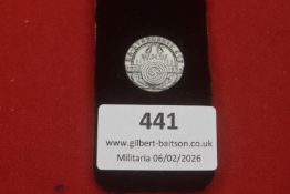 A Third Reich WHW Standarte donation badge dated 1935–1936, circular form with central swastika