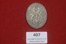 A Third Reich presentation medallion engraved “Hans Klein – Für Treue – Weihnachten 1935 – Hermann-