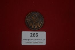 German WHW tinnie dated 1935–1936, circular bronze-finished example bearing spade and wheat-ear