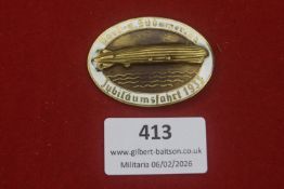 Third Reich Nord- u. Südamerika Jubiläumsfahrt 1933 Zeppelin badge, white enamel border with gilt
