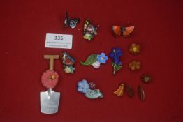 A mixed group of German WHW and novelty decorative items, including ceramic and composite floral