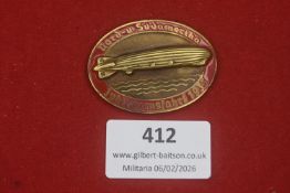 A Third Reich Nord- und Südamerika Jubiläumsfahrt 1933 badge, enamelled red-bordered variant with