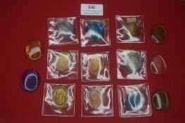 A large group of German translucent portrait medallions, mostly housed in protective sleeves,