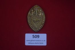 German Kreisturnfest ski festival badge, dated 1930, oval gilt-finished example with oakleaf