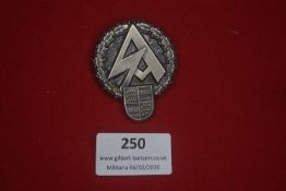 German Alpine or hiking association badge, circular wreath enclosing stylised mountain motif and