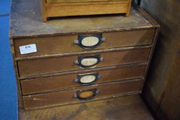 Vintage wooden filing drawer unit, four long drawers with recessed metal label handles,