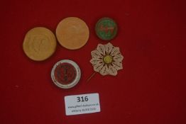A small group of German WHW and civic badges, including pressed wood and painted examples with