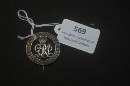 British “For King and Empire – Services Rendered” badge, George V issue, circular bronze example