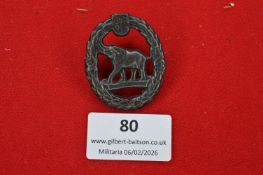 German shooting or sporting badge, oval wreath enclosing a standing elephant motif. Darkened metal