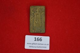 German civic commemorative tinnie, rectangular form depicting a tower monument and inscribed “