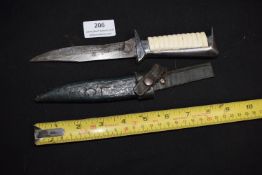 Small hunting or utility knife, likely European, with single-edged blade showing wear and