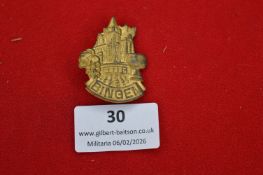 German Bingen town commemorative badge, shaped gilt-brass example depicting town architecture with