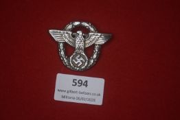 Third Reich political eagle and wreath badge. Circular openwork badge featuring spread-wing eagle